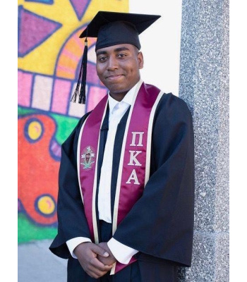 a man in a graduation gown